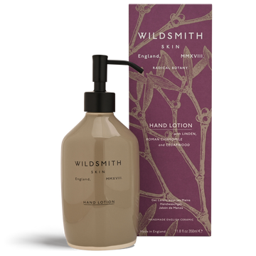 Hand lotion bottle with pump and packaging featuring 'Wildsmith' branding on a white background.